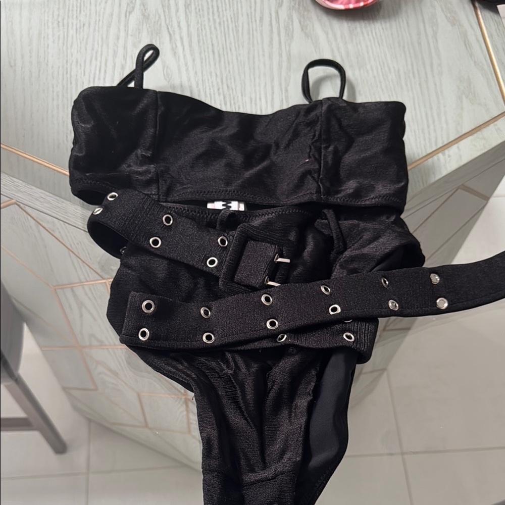 Stunning black bikini with high waisted bottoms and belt.